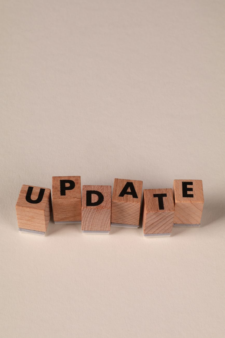 wooden blocks with update text on neutral background